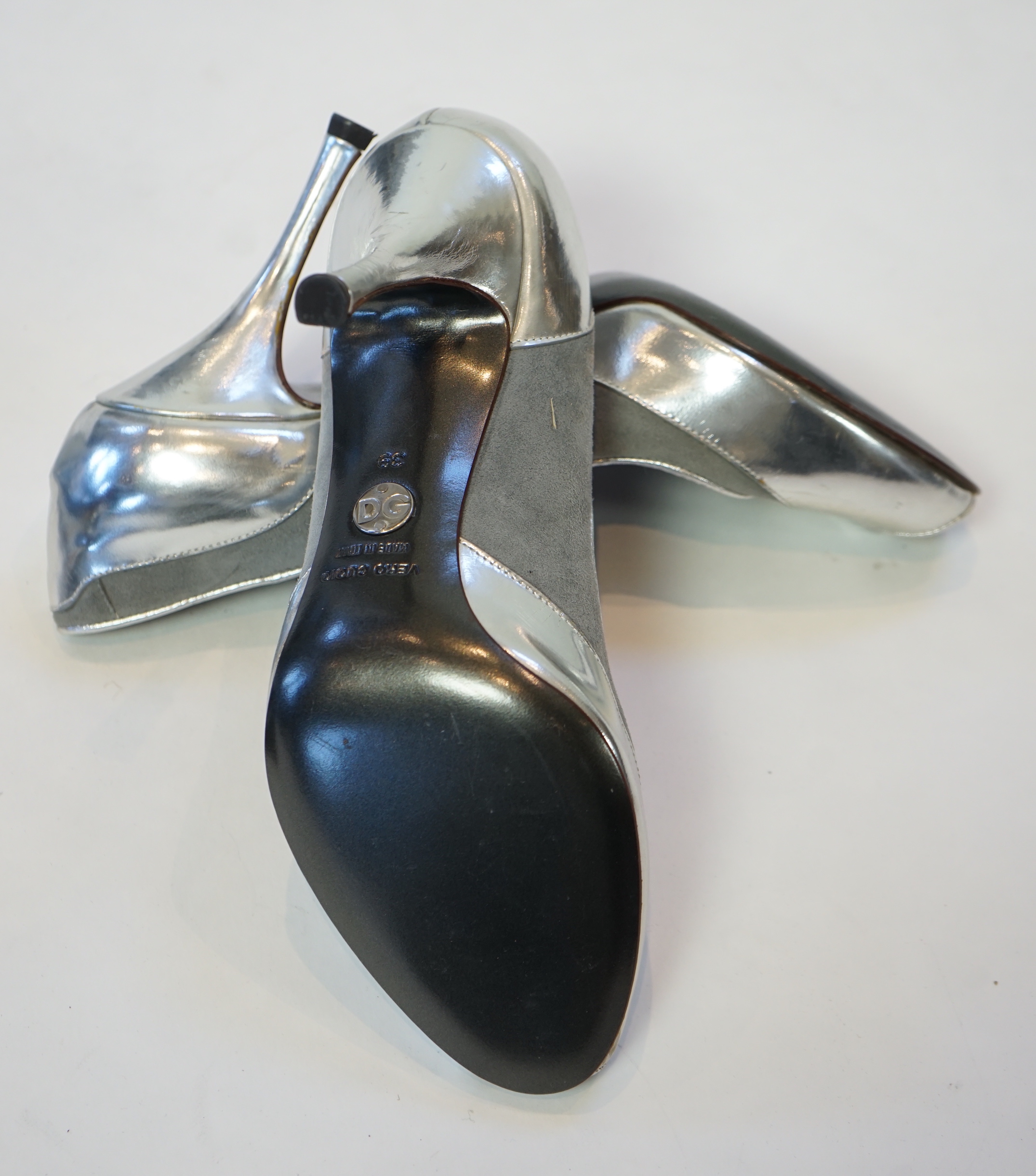 A pair of Fendi lady's metallic silver sandals with three diamante circle detail and a pair of Dolce and Gabbana silver patent leather and suede peep toe heels, size EU 39/40